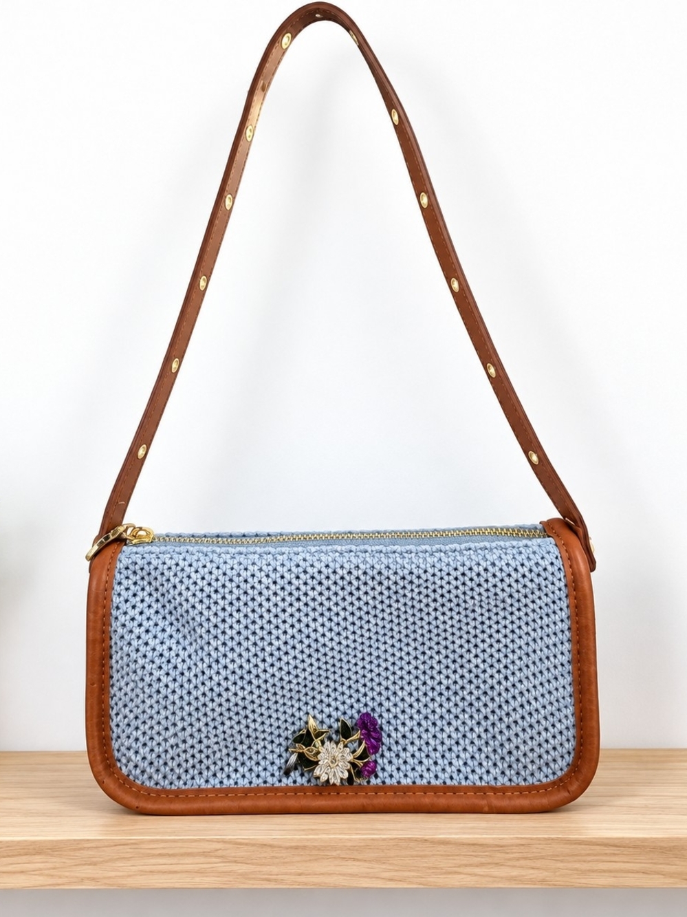 Light Blue Woven Shoulder Bag with Brown Leather Trim and Floral Accent